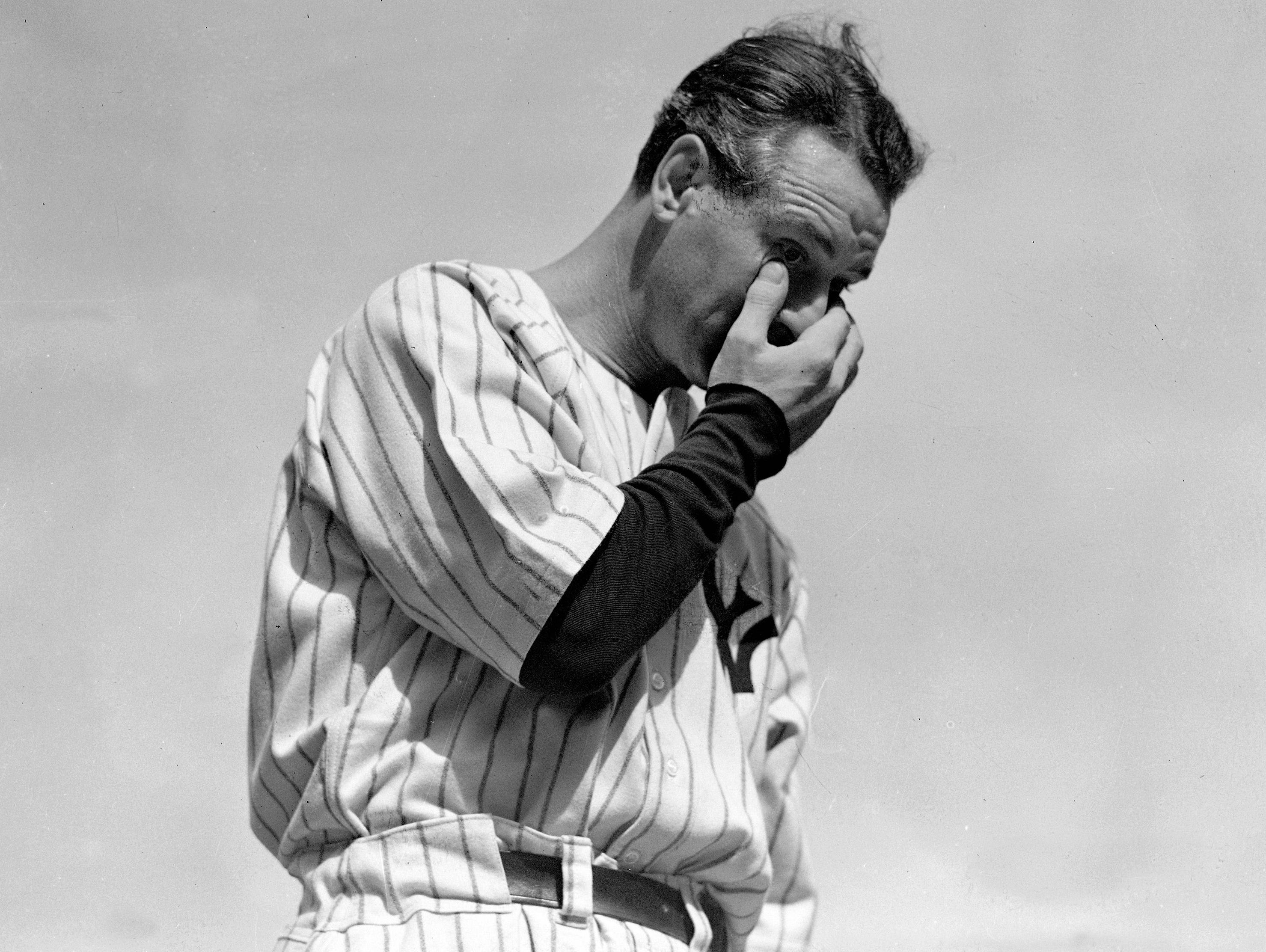 Lou Gehrig wipes away a tear while speaking during a tribute at Yankee Stadium in New York on July 4, 1939.