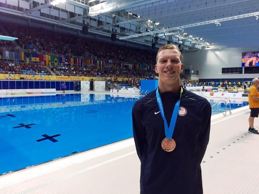 Max Williamson celebrates with his bronze medal in Toronto.