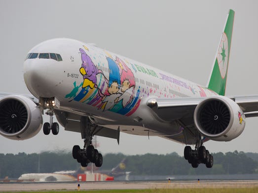 EVA Air's newest Hello Kitty Boeing 777-300ER jet lands
