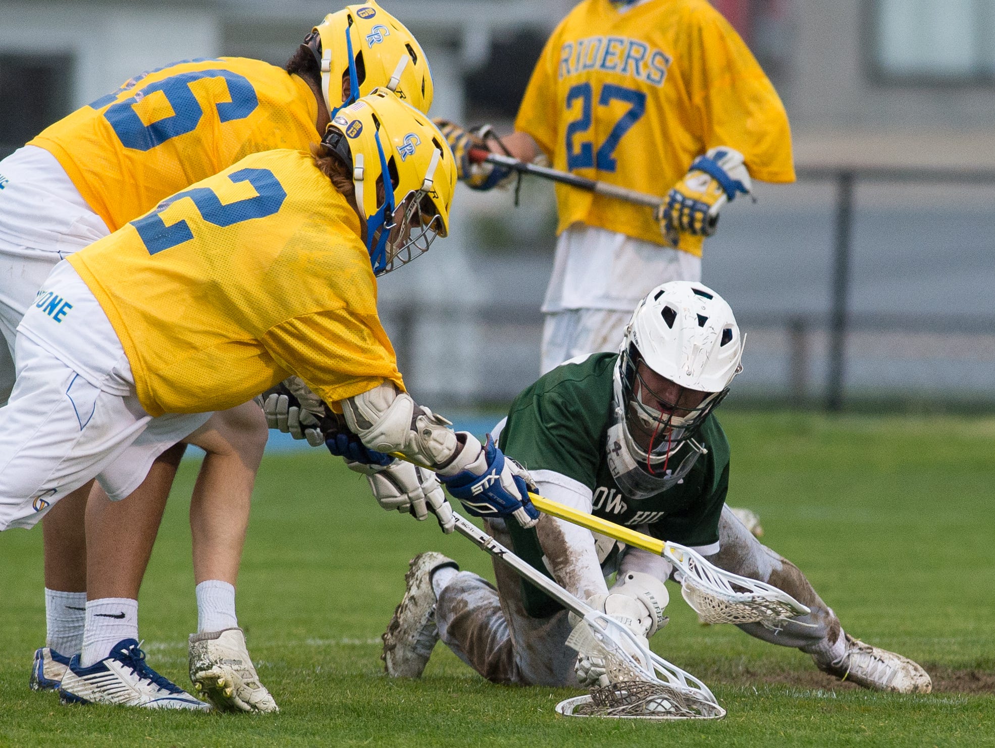 Tower Hill's goalie Michael Gianforcaro (27) dives on the ball covering it in their win over Caesar Rodney.