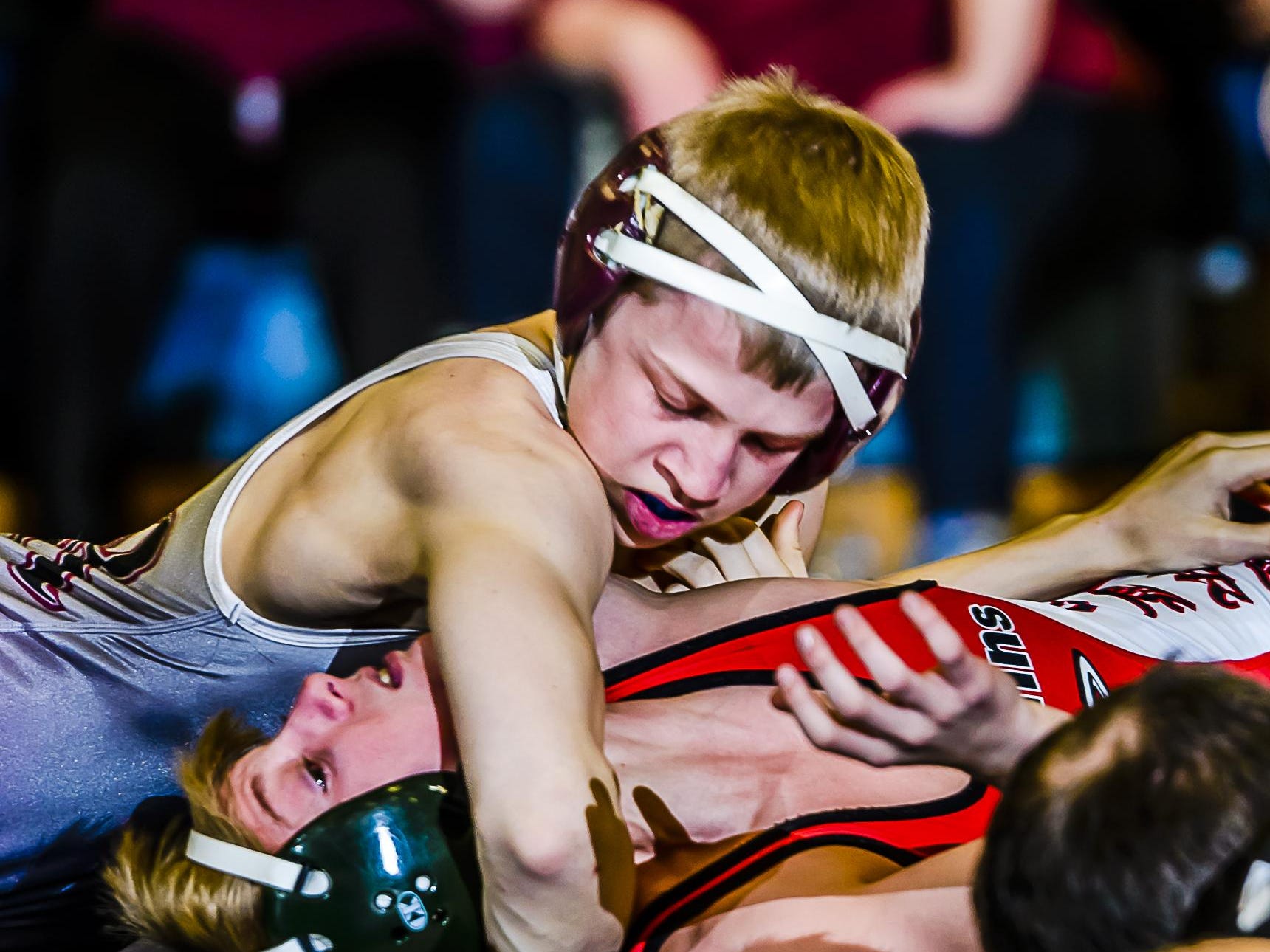 Tyler Koehn,top, of Eaton Rapids gets a near pin on Brendon Smith of St. Johns during their 103lb. match in their Division 2 Regional final Wednesday February 17, 2016 in Mason. Koehn would win by a fall.