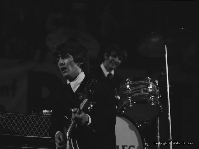 George Harrison and Ringo Starr in concert.