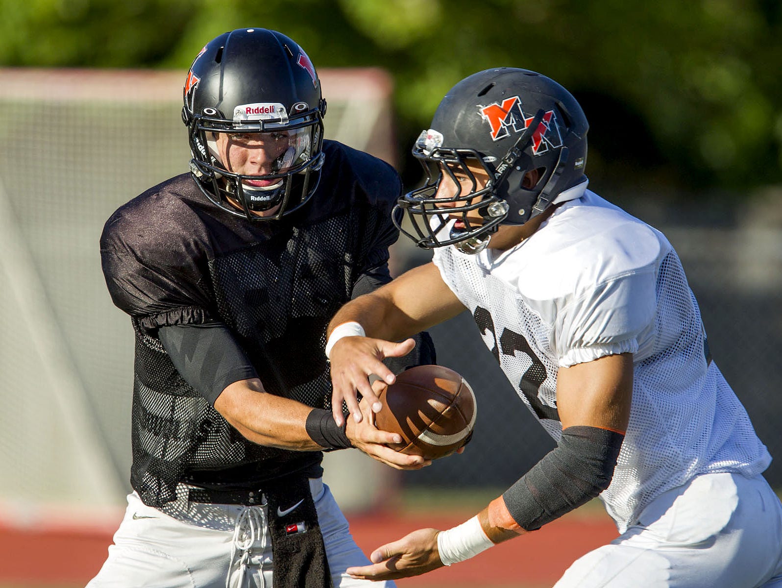 Middletown North, led by junior quarterback Donald Glenn (left) and senior running back Chad Freshnock (center)), will meet Middletown South Friday night in a NJSIAA North II Group IV semifinal