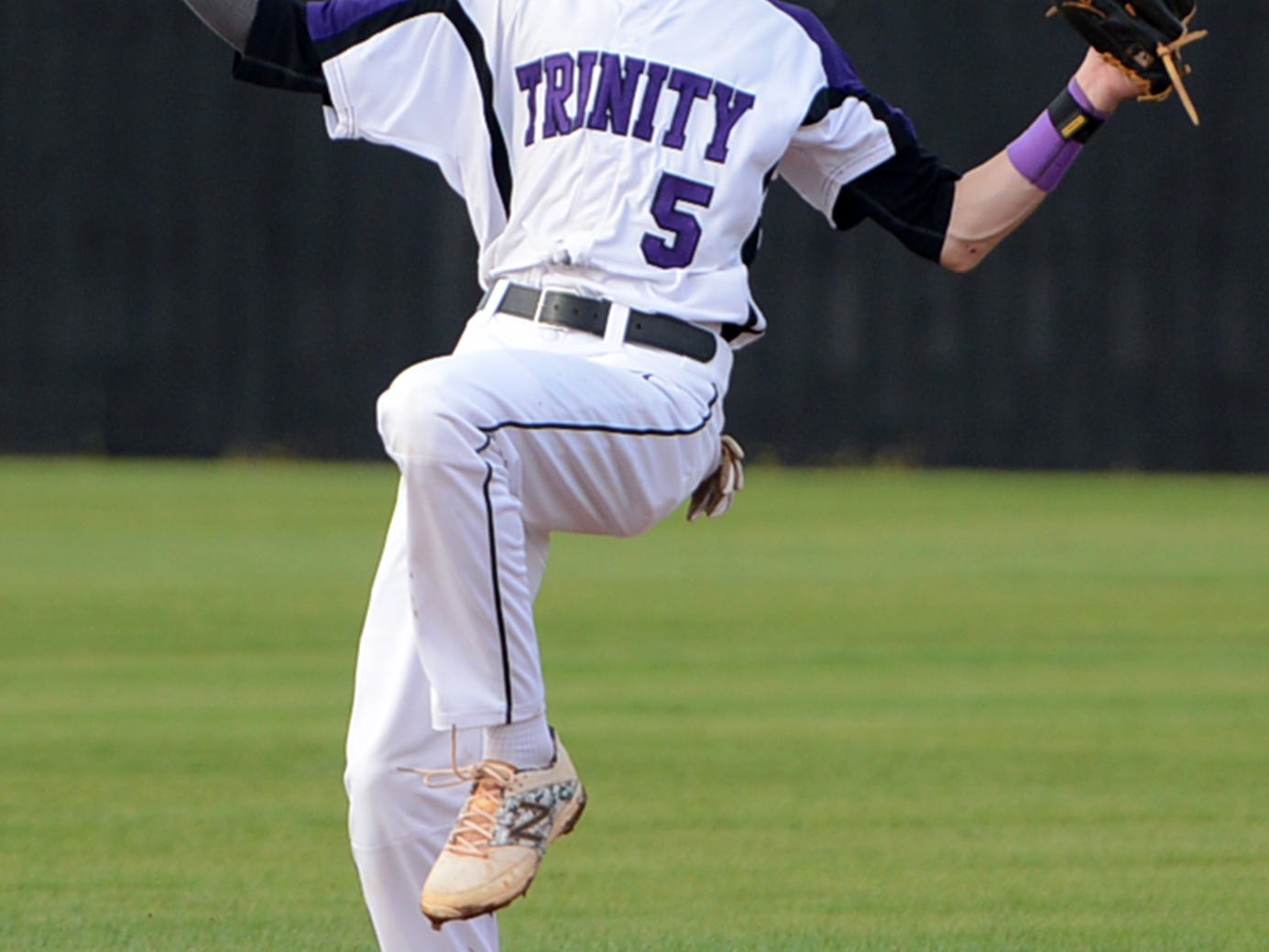 Trinity Christian Academy's Tyler Thomas makes a catch at second base during Tuesday night's game against Adamsville.