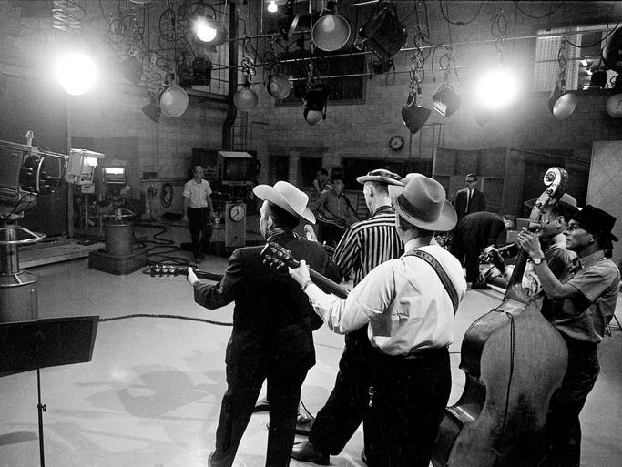 David "Stringbean" Akeman, striped shirt, performs with Lester Flatt and Earl Scruggs during a taping of the "Lester Flatt and Earl Scruggs Show" on Sept. 11, 1963.
