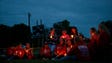 Mourners gather during a vigil for Lea Phann at the