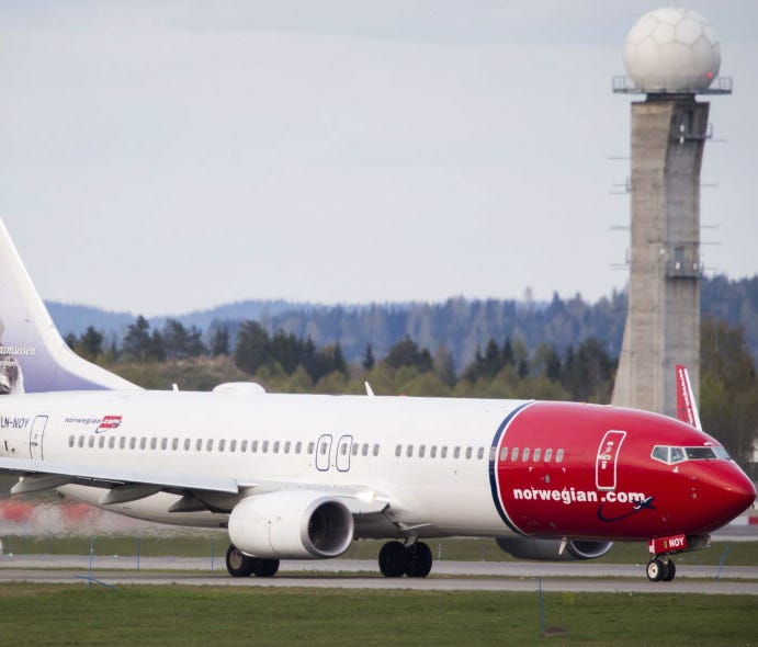A Boeing 737-33S operated by Norwegian Air Shuttle sits on the tarmac at the Oslo Airport Gardemoen on May 2, 2014. Norwegian announced Thursday flights from Boston, New York and Baltimore-Washington to the Caribbean starting Dec. 3.