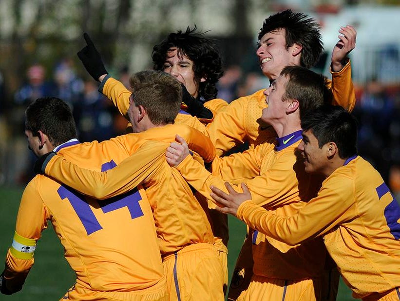 The Rhinebeck High School boys soccer team celebrates its win in the Section 9 Class C state semifinals on Nov. 15, 2014 in Middletown.