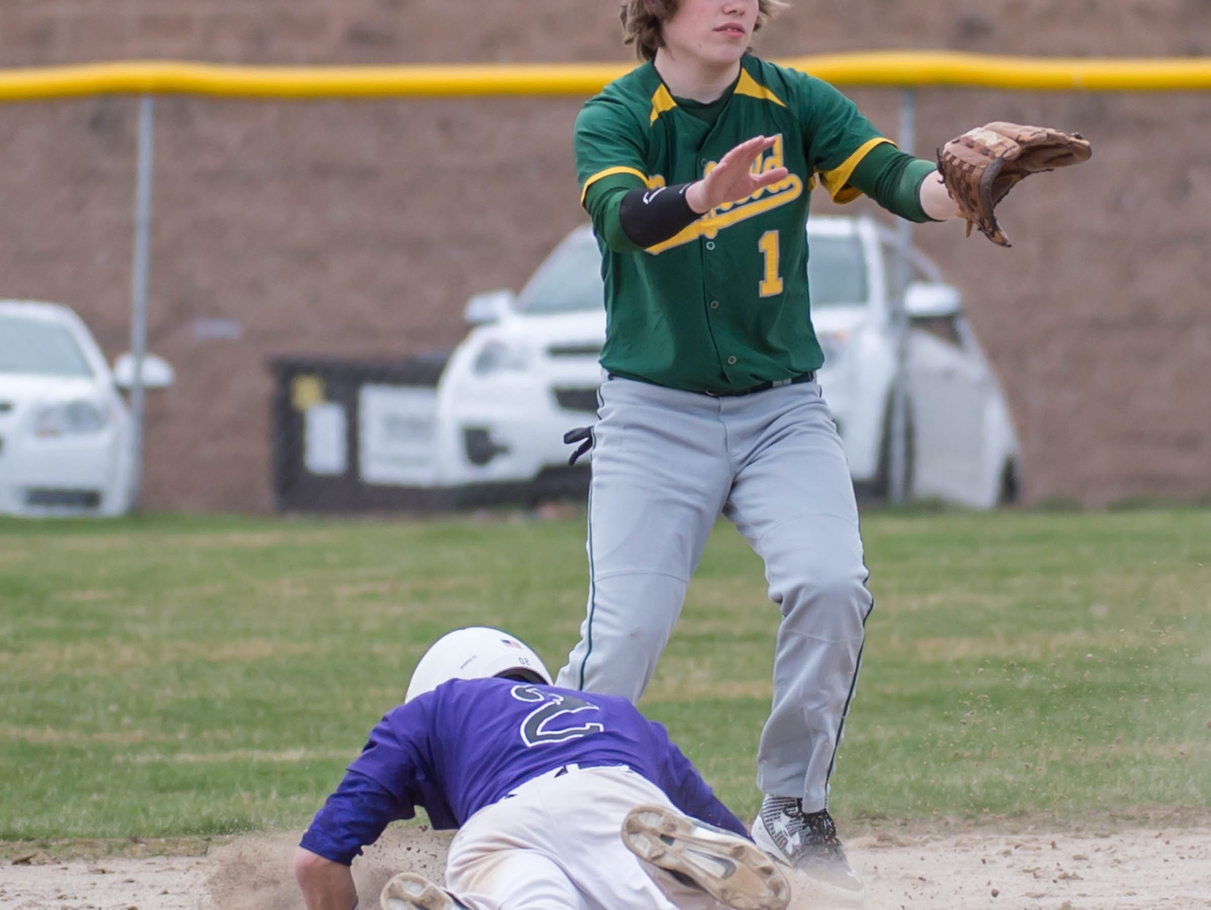 Pennfield's Tyler Eddy (1) covers second as Lakeview's Gavin Homer (2) slides back.
