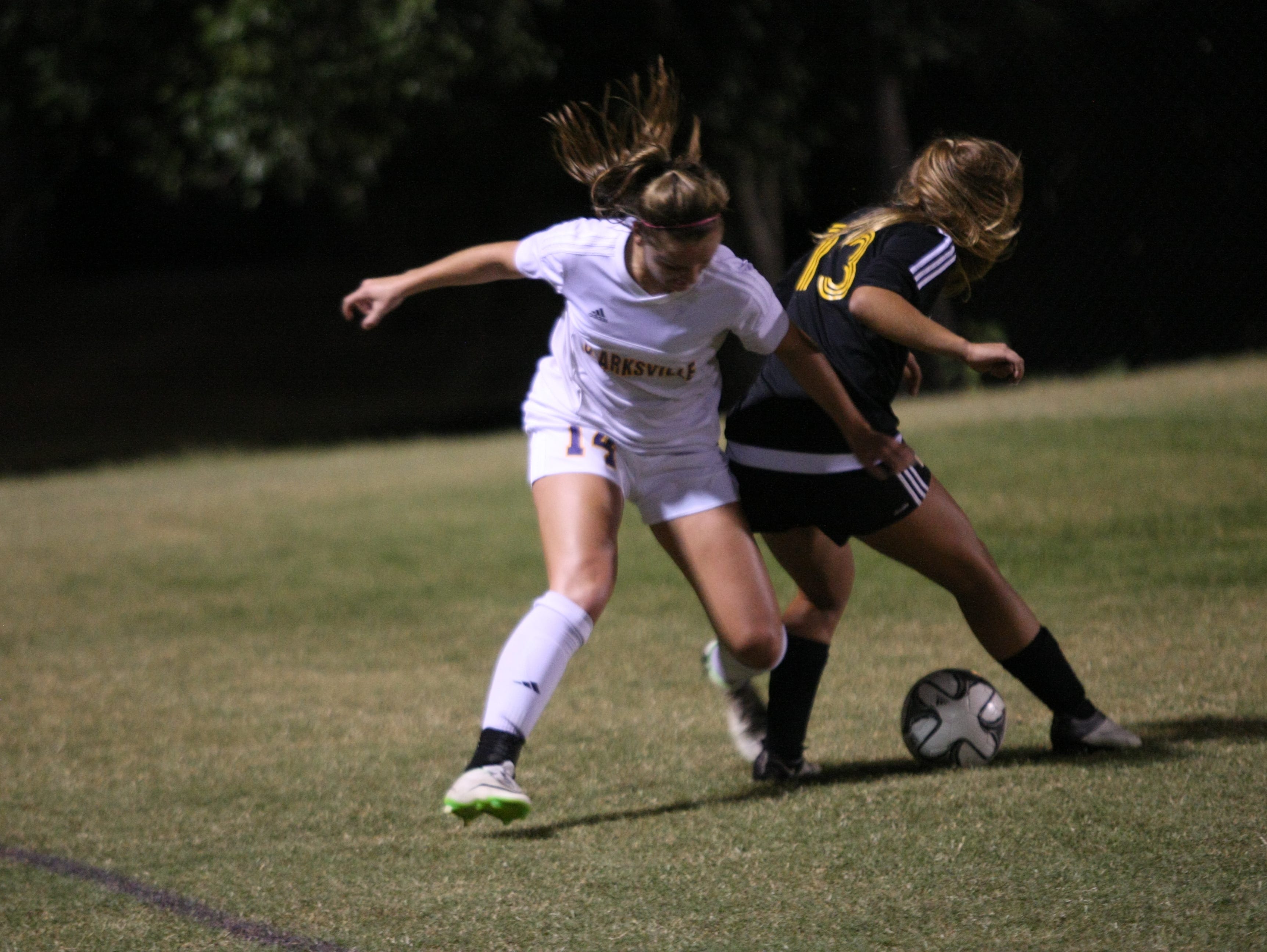 Clarksville senior forward Lexie Hayes battles for possession with Hendersonville senior Jada Campbell during the Region 5-AAA Tournament championship match.