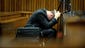 Olympic and Paralympic track star Oscar Pistorius reacts during his trial on March 10 at the North Gauteng High Court in Pretoria, South Africa. Pistorius is on trial for shooting and killing his girlfriend, Reeva Steenkamp, on Valentine's Day on 2013. He said he shot her by mistake, thinking she was an intruder.