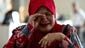 A relative of a passenger on the missing Malaysia Airlines aircraft cries as she arrives at the Everly hotel in Putrajaya, Malaysia.