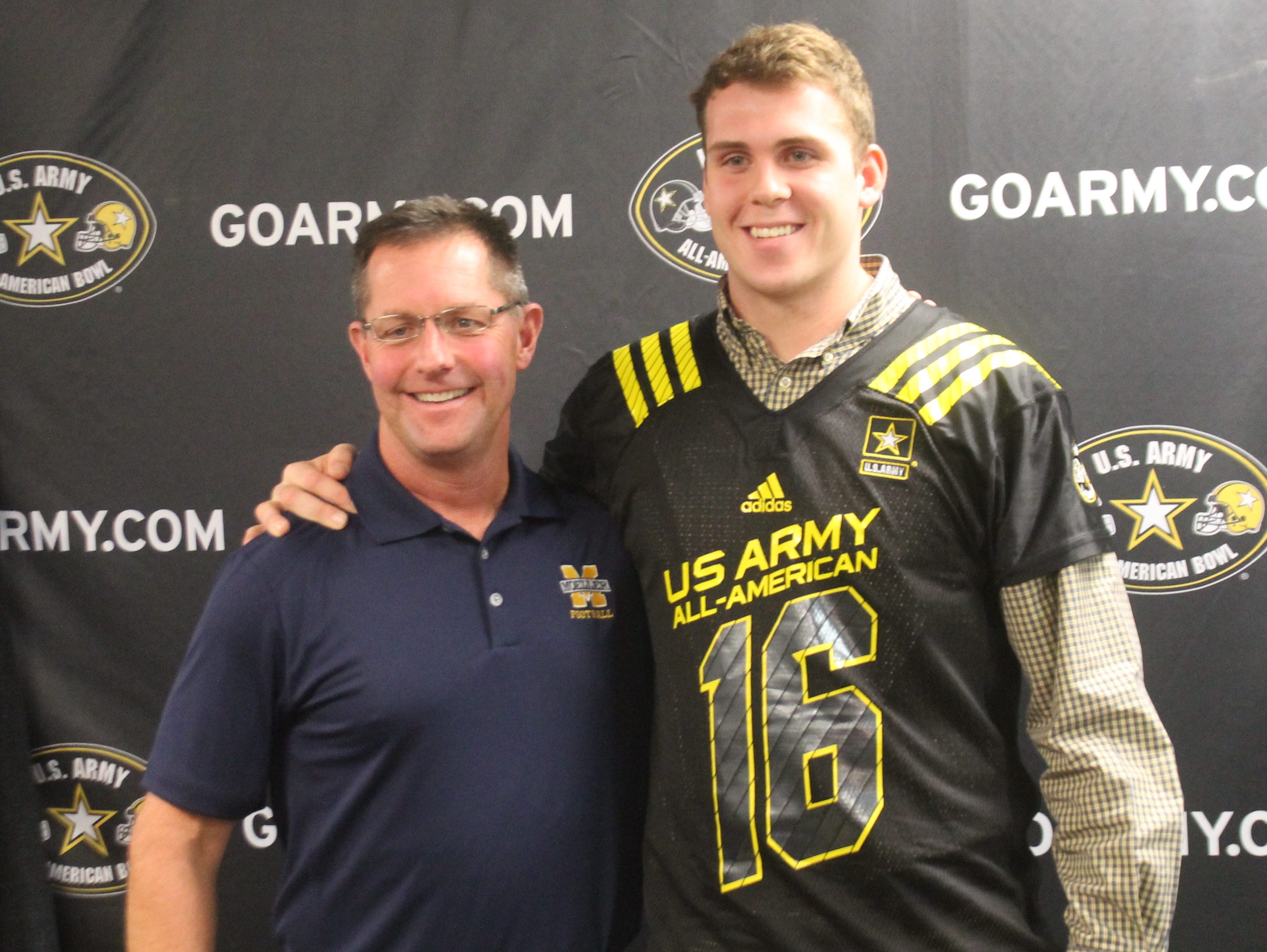 Moeller tight end Jake Hausmann will participate in the U.S. Army All-American Bowl in January. With Hausmann is Moeller head coach John Rodenberg