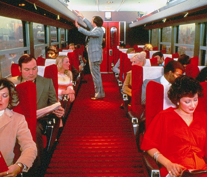 Turboclub interior, 1978. In 1976-77, RTL Turboliners were delivered to Amtrak for use on routes serving New York State, including the Empire Service (New York-Albany-Buffalo) and Adirondack (New York-Montreal). All-reserved Club car service – known 
