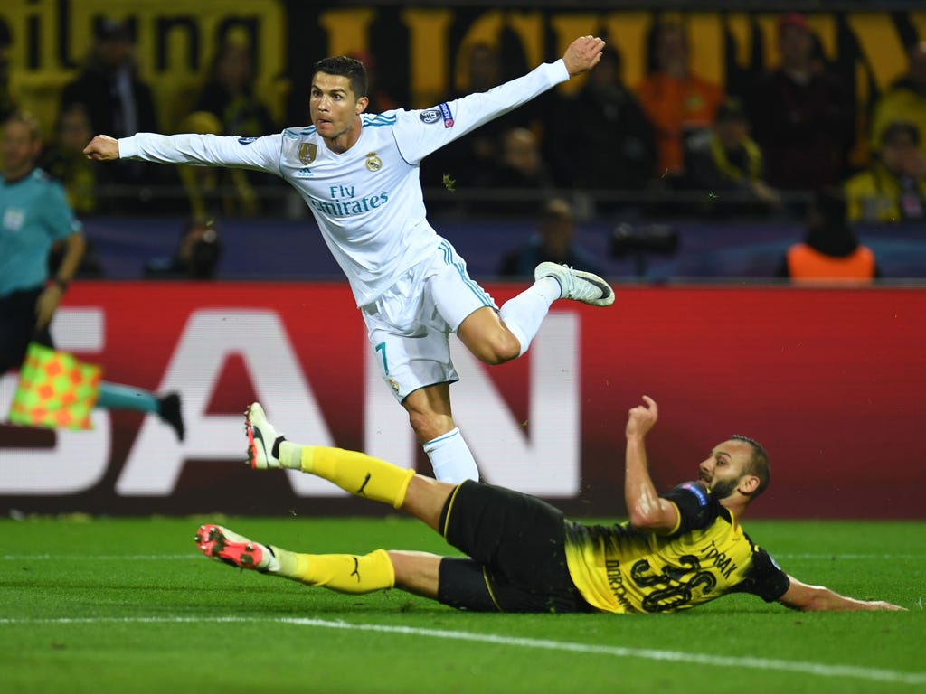 Real Madrid's Cristiano Ronaldo scores during the UEFA Champions League Group H match against Borussia Dortmund in Dortmund, Germany.