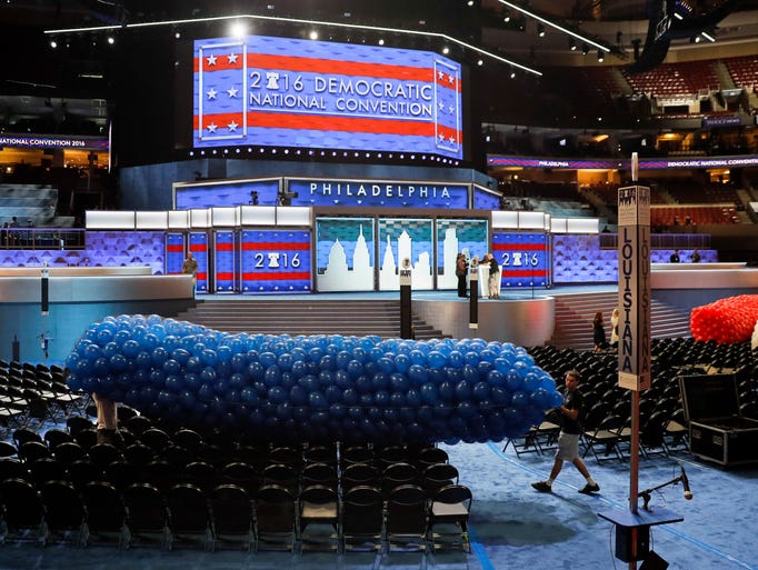 Workers prepare a mass of balloons for the 2016 Democratic