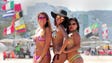 Women pose at Copacabana Beach.