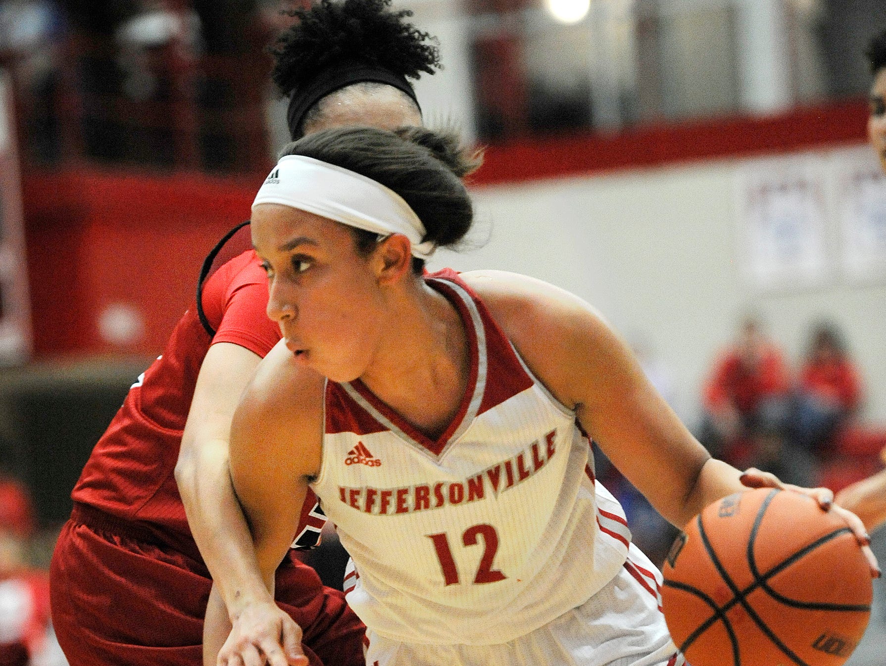 Jeffersonville's Jacinta Gibson (12) drives to the basket against New Albany on Friday at Jeffersonville High School. Jan.20, 2017