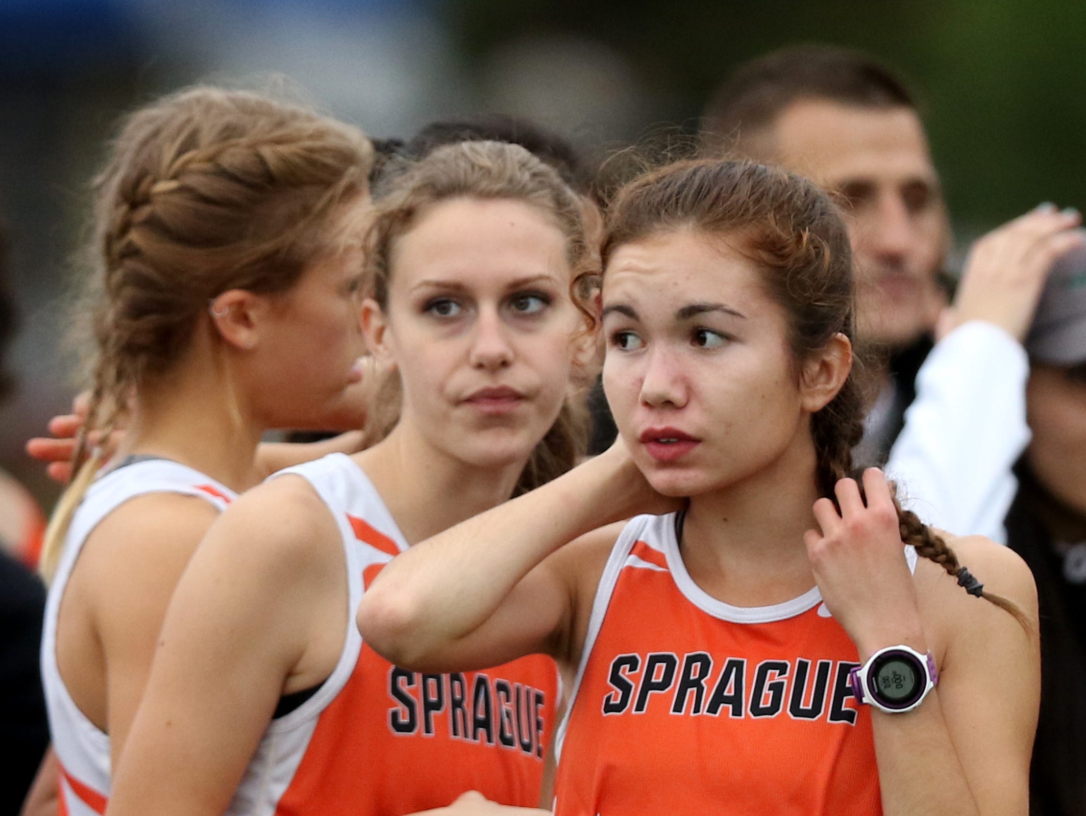Sprague runners prepare to compete in the Greater Valley Conference championship girl's 5K race at the Crystal Lake Sports Park in Corvallis on Wednesday, Oct. 26, 2016. Sprague's Ginger Murnieks finished first.