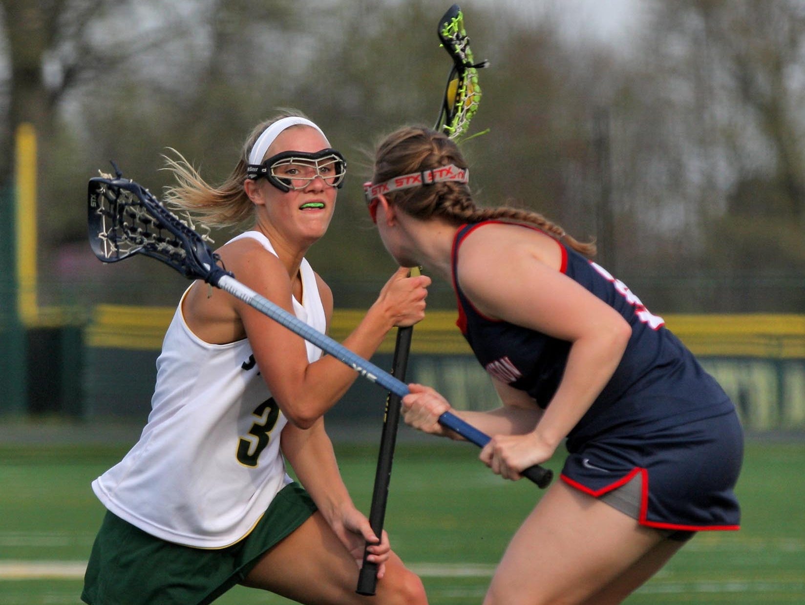 Sycamore's Brittany Murphy, left, is on the attack against Thomas Worthington.