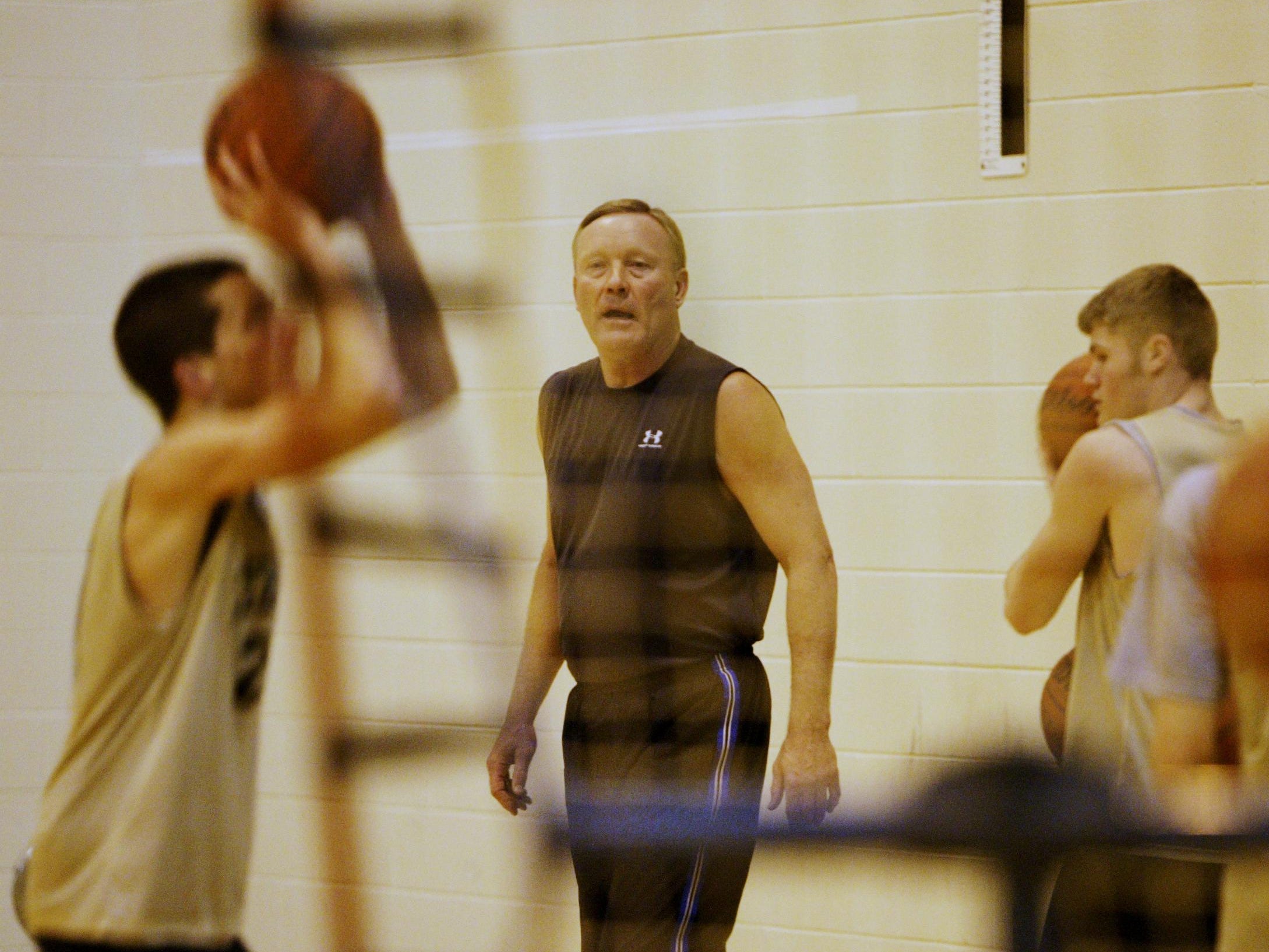 FILE PHOTO FROM 2008 Rick Mount directs Lebanon High School boys basketball players through a shooting drill at the high school Thursday February 16. Mount was one of the greatest shooters in college basketball history at Purdue after winning Mr. Basketball at Lebanon High School. He's been helping the Lebanon girls' basketball team with its shooting for several years, a factor in the team's undefeated/No. 1 ranked season and berth in th e ISHAA regionals. (Joe Vitti/Indianapolis Star)