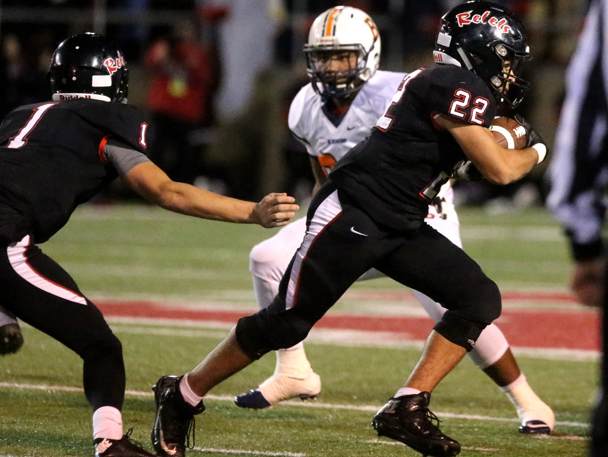 Maryville's Jordan Ervin (22) runs the ball after Maryville's quarterback Dylan Hopkins hands the ball off to Ervin during the quarterfinal game against Blackman, at Maryville, on Friday, Nov. 20, 2015.
