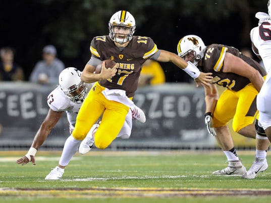 Inside the game: Wyoming QB Josh Allen naked and famous