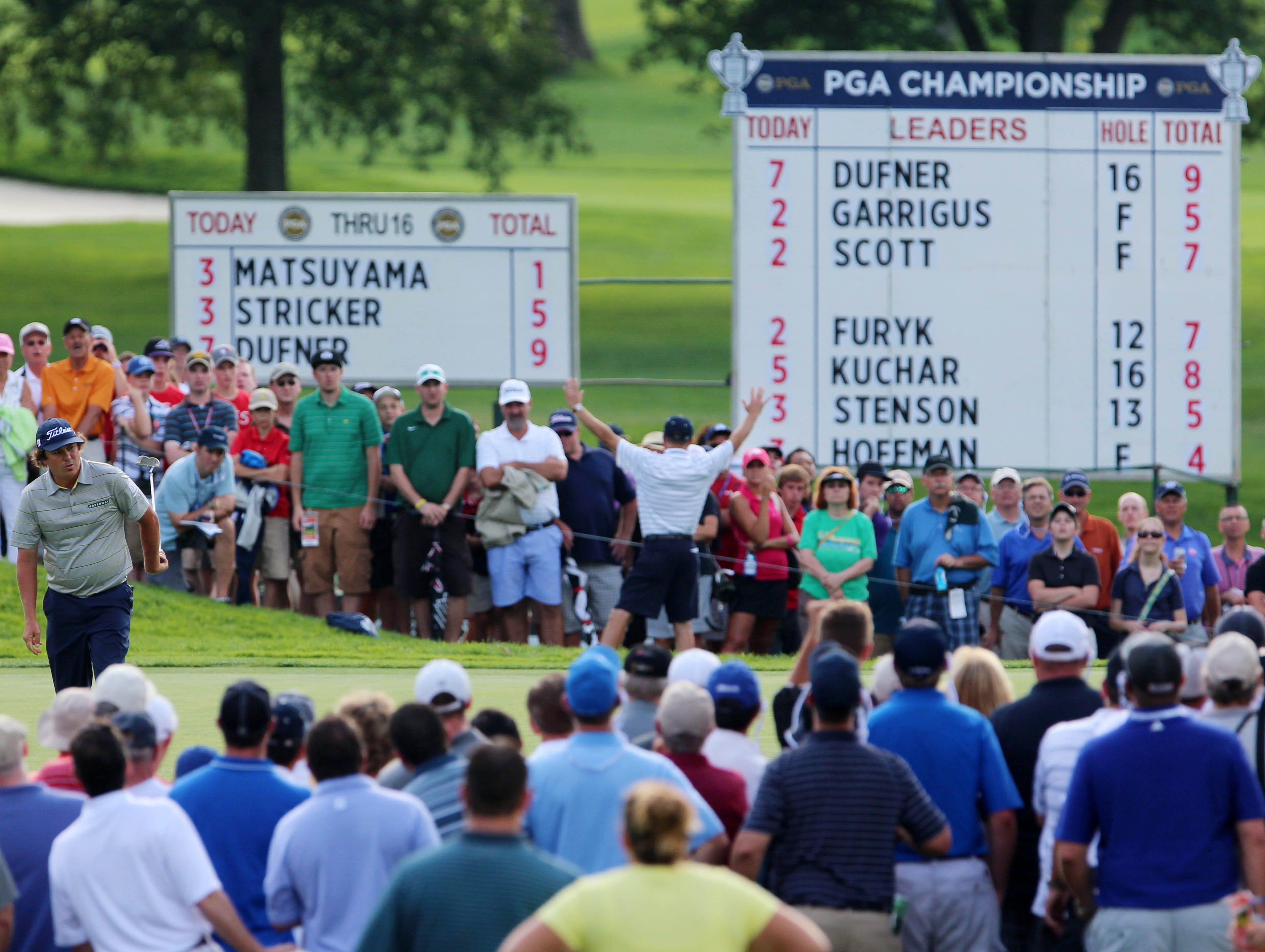 Jason Dufner watches another successful putt, this one on the 17th green.