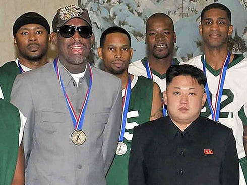 This photo taken on Jan. 8, 2014, and released by North Korea's official Korean Central News Agency shows North Korean leader Kim Jong-Un,  front right, with former U.S. basketball star Dennis Rodman, left.