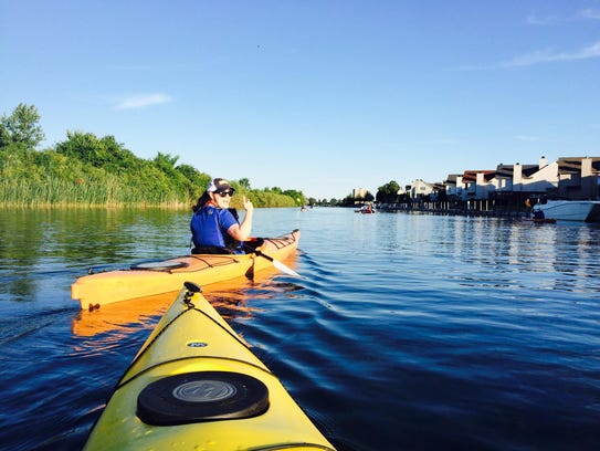 Adrienne Mahan of Detroit paddles with friends down