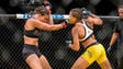 Amanda Nunes punches Miesha Tate during their bantamweight