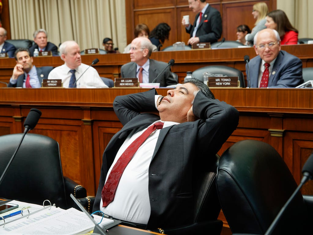 After working through the night, House Energy and Commerce Committee member Rep. Tony Cardenas, D-Calif., stretches while members of the committee argue the details of the GOP's 'Obamacare' replacement bill on March 9, 2017, on Capitol Hill in Washin