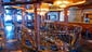 In the center portion of the Pinnacle Club, there is a large bar.  Venetian crystal chandeliers hover over stairs that lead down to the Spirit Dining Room.  This is the ship’s designated cigar-smoking area.