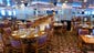 The first of two nearly identical dining rooms on Atlantic Deck, the 650-seat Pride, is named for (Carnival-owned) Seabourn Cruise Line’s deluxe MV Seabourn Pride.  The central section is slightly raised.