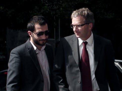 European Central Bank's (ECB) Mission Chief for Greece Klaus Masuch, right, arrives at the Finance Ministry in Athens for a meeting with the Greek finance minister.