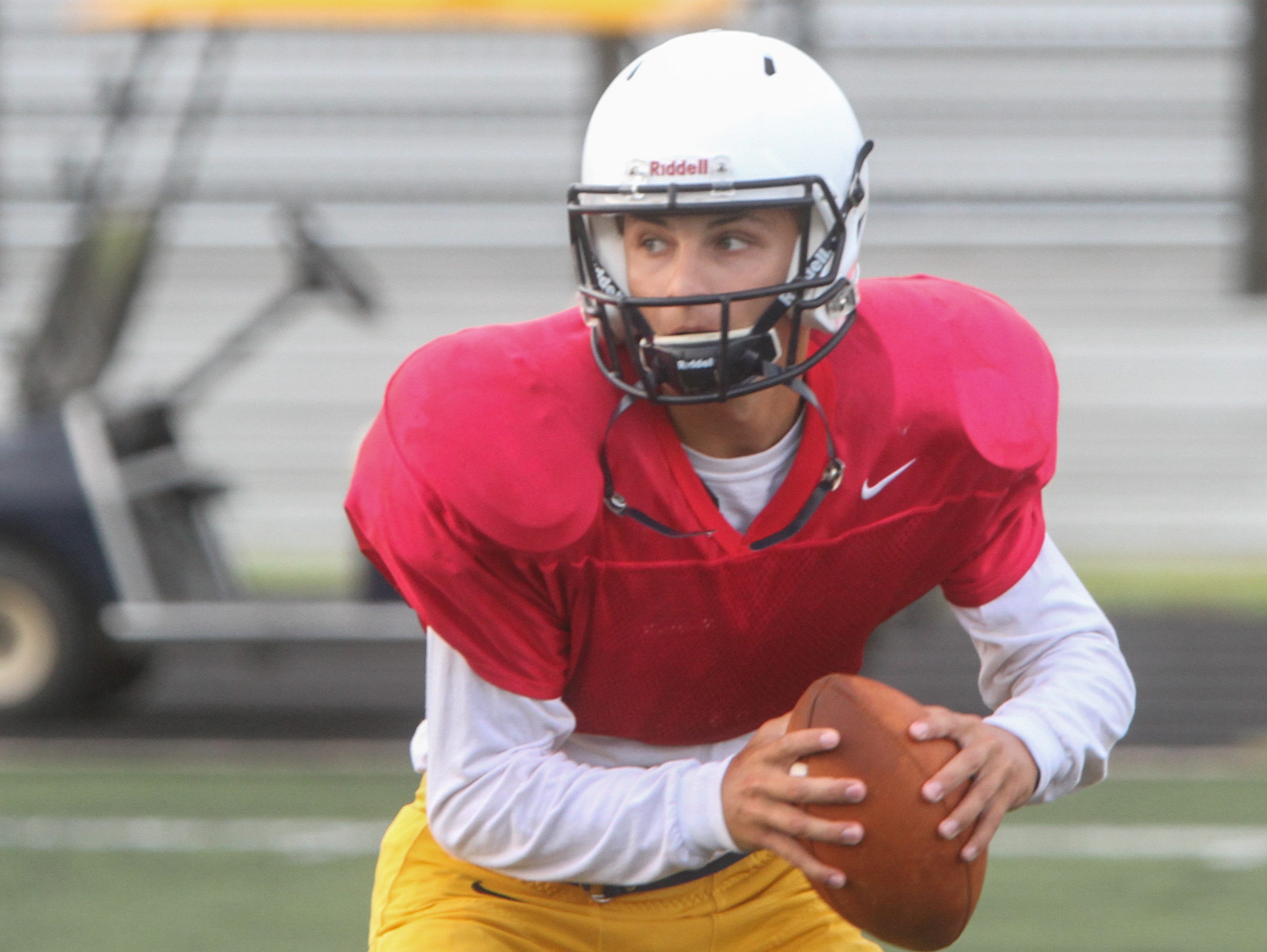 TOM SPADER/STAFF PHOTOGRAPHER Toms River North's Mike Husni looks to pass for Toms River North during practice in the 2015 season Toms River, NJ QB Mike Husni - during Toms River High School North pre season football practice. 081915