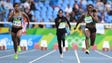Runners compete in a women's 100-meter preliminary