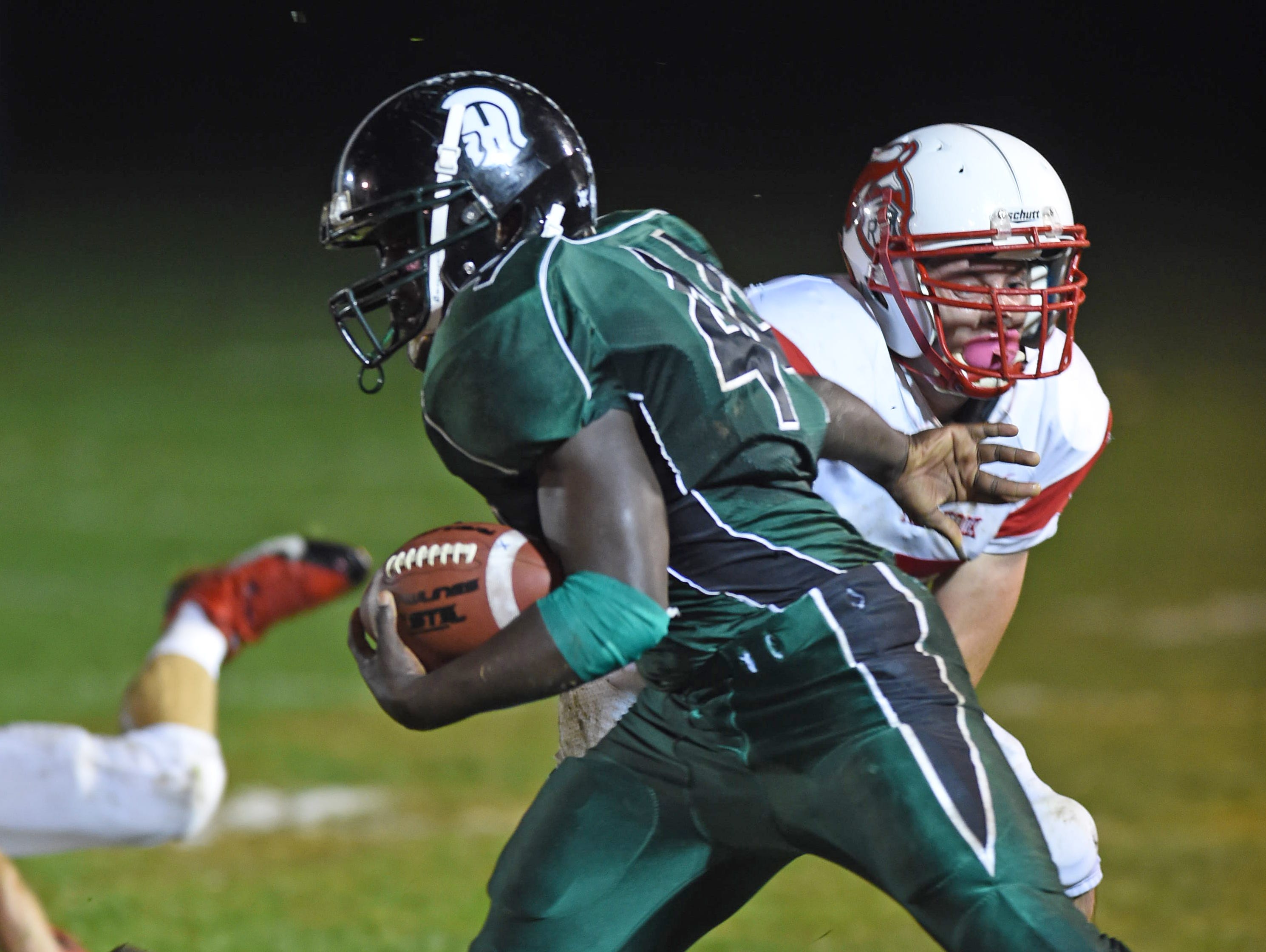 Spackenkill's Dhyquem Lewinson breaks away from Red Hook's Nick Mchitsch during Friday's game in Poughkeepsie.