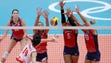United States players go up for a block in semifinal