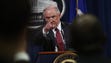 Sessions takes questions during a press conference