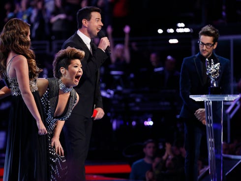 Tessanne Chin, second from left, reacts after hearing her name announced Tuesday as the winner of 'The Voice.'