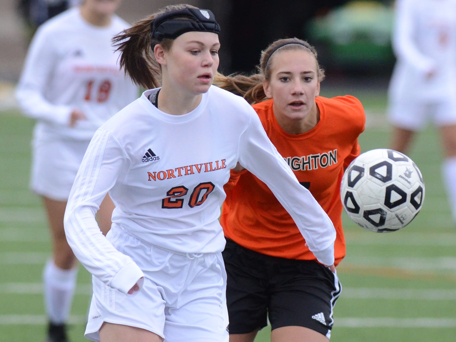 Northville's Nicole Skinner (left) cuts in front of a Brighton player to gain possession.
