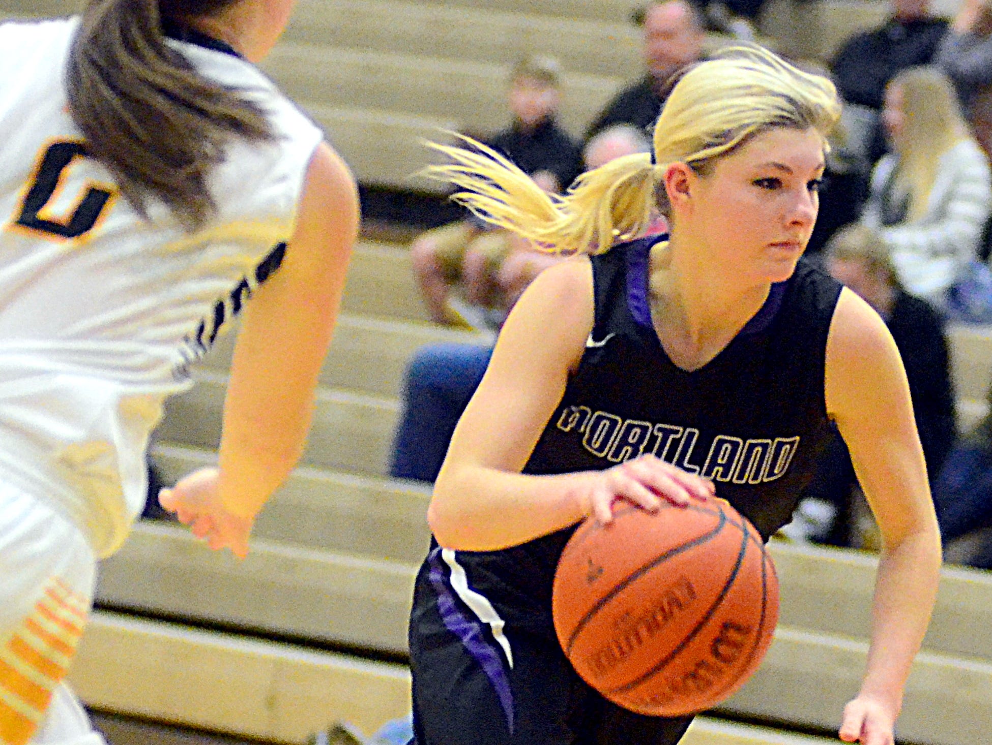 Portland High senior guard Erica Keen drives into the lane during second-quarter action. Keen scored four points.