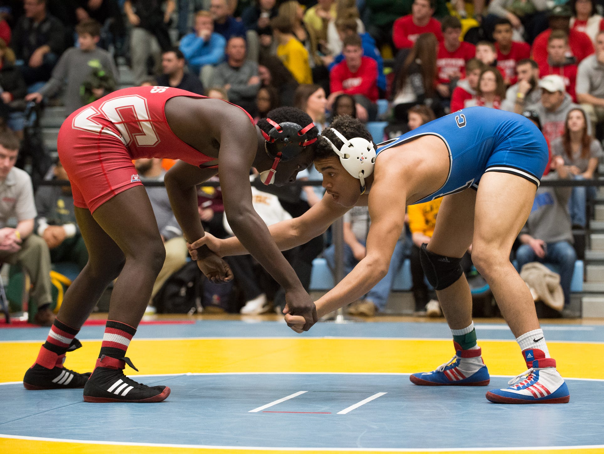 Middletown's Isiah Mitchell, right faces off against Smyrna's Larsen Wilson in the 170 pound quarterfinals at the DIAA Individual State Tournament at Cape Henlopen High School.