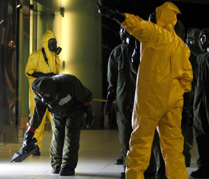 A hazmat crew scan the decontamination zone at Kuala Lumpur International Airport where North Korean ruler Kim Jong Un's half brother was killed by a dose of nerve agent.