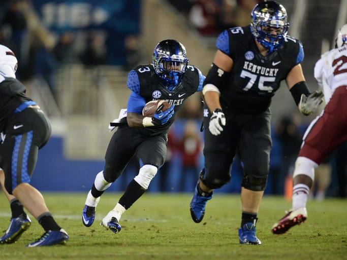 UK RB Jojo Kemp runs out of the Wildcat formation during the second half of the University of Kentucky Wildcats Football game against the South Carolina Gamecocks in Lexington, KY. Saturday, October 4, 2014.