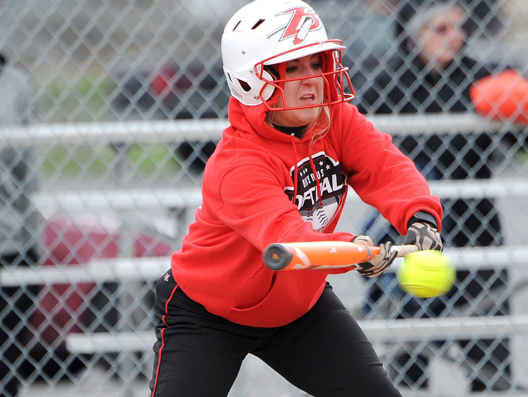 Bucyrus' Izzy Burling bunts the ball Wednesday evening during their game against Upper Sandusky.