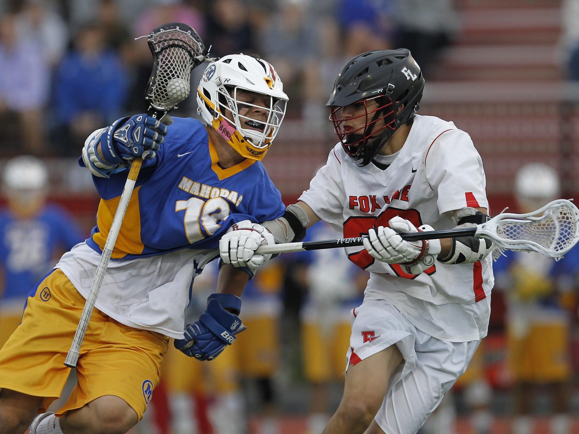 Mahopac’s Andrew Evans works against Fox Lane’s Matt Harrison during a Class A quarterfinal at Fox Lane High School in Bedford on Wednesday.