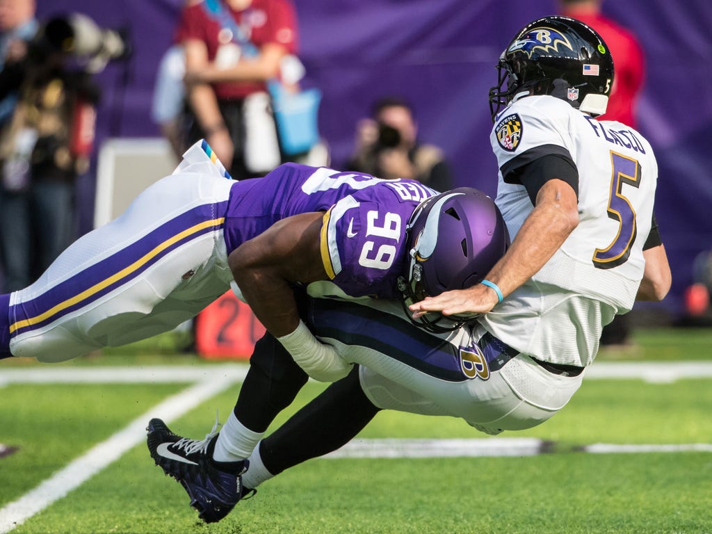Baltimore Ravens quarterback Joe Flacco is sacked by Minnesota Vikings defensive end Danielle Hunter during the first quarter at U.S. Bank Stadium in Minneapolis.
