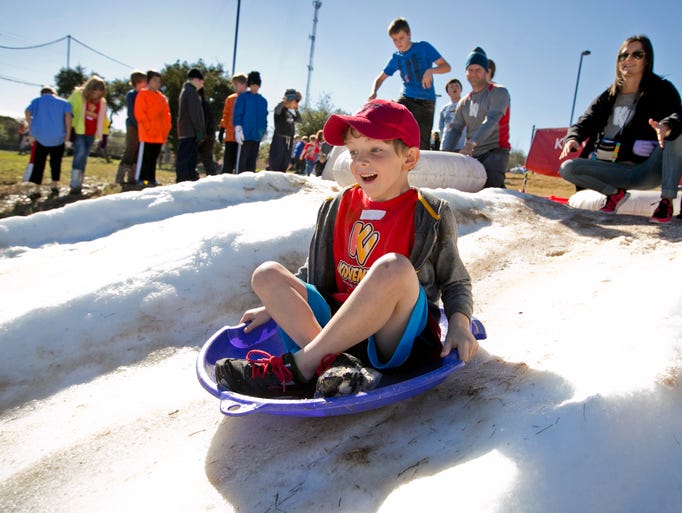 Kase Knussman sleds down a hill with 30,000 lbs. of